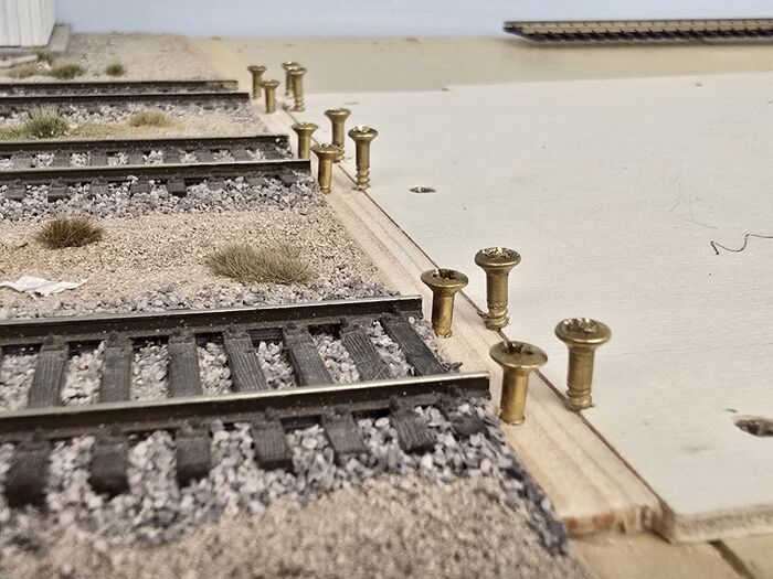 Brass screws at the end of a segment